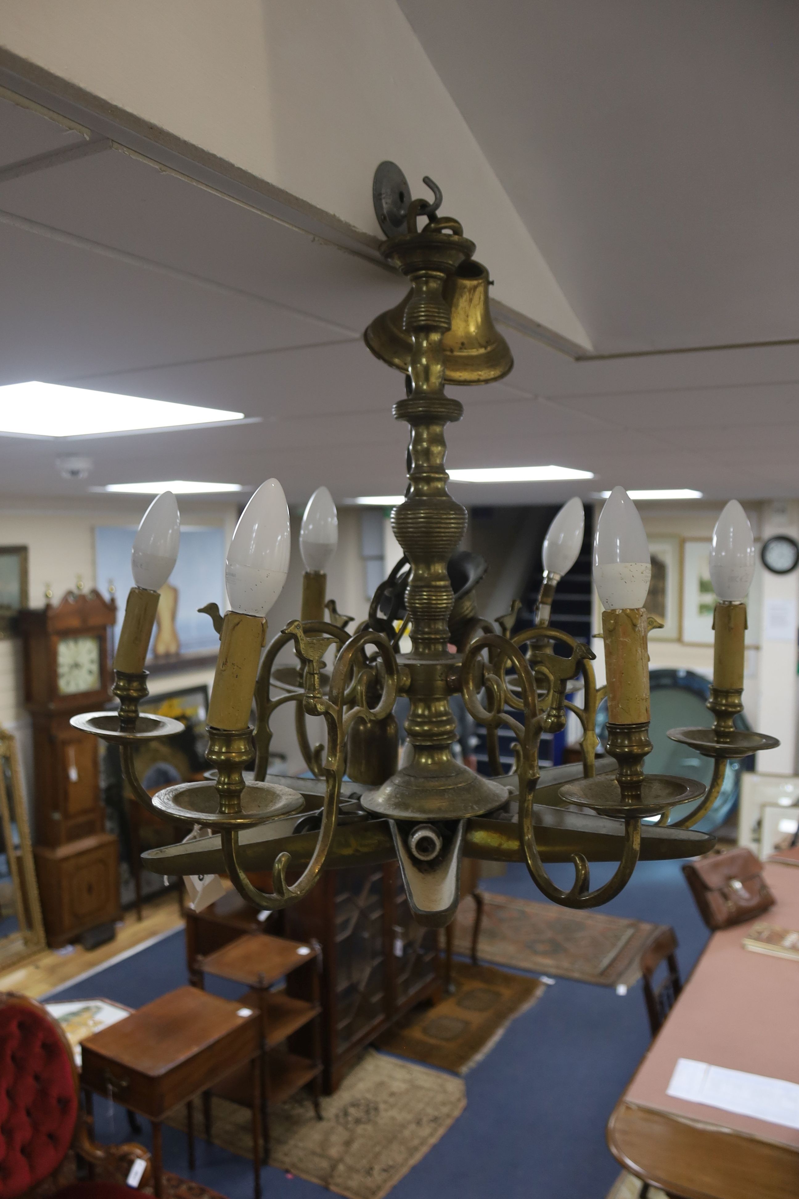 A 19th century Dutch brass six-light electrolier with star-shaped base and drop